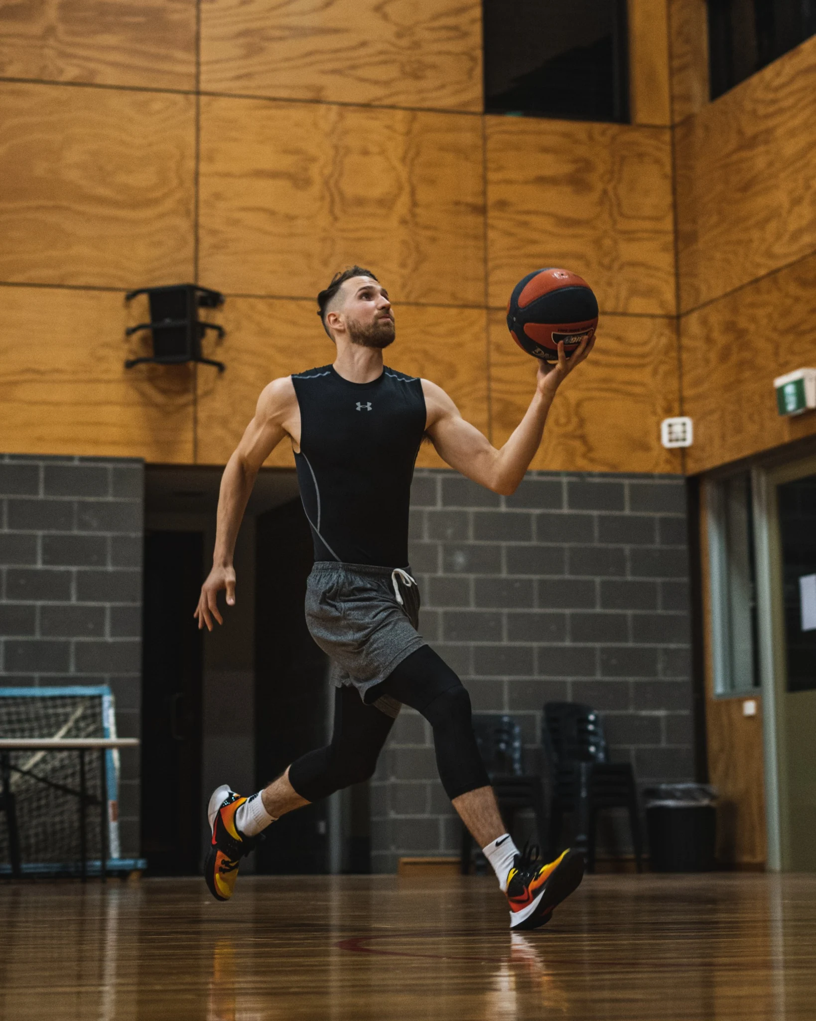 Jarrod Molnar practicing on a basketball court